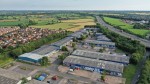 Industrial estate warehouses in context with the motorway